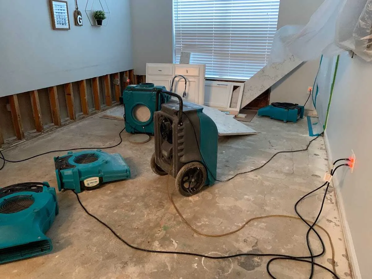 Dehumidifier in flood-cut room for Water Damage Restoration in Price